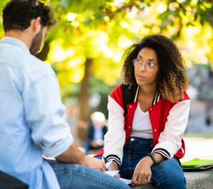 Photo of two Students Sitting